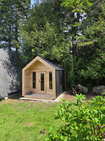 Modern Cabin Sauna with Steel Roof and Siding with 2 Front Windows