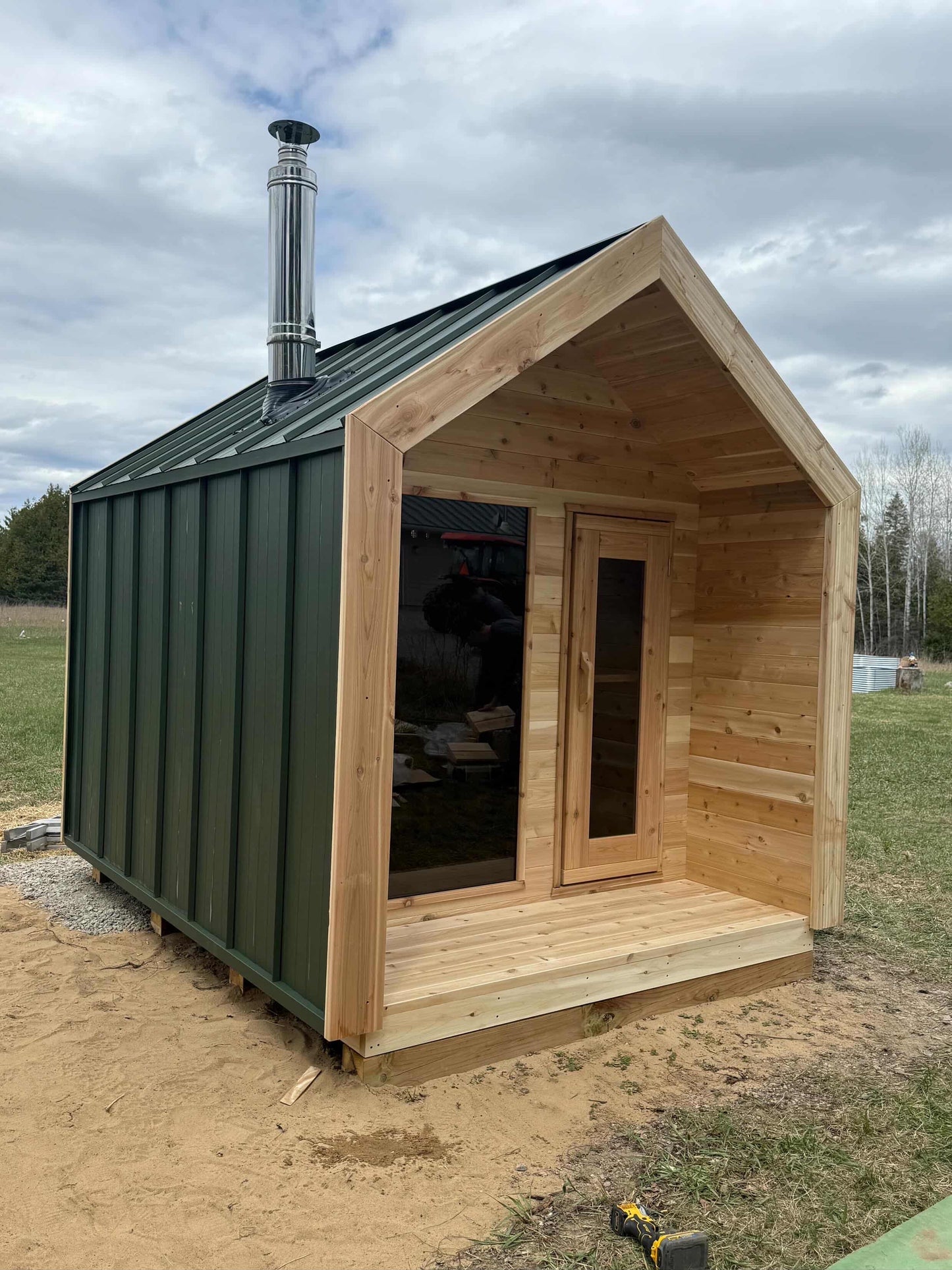 Modern Cabin Sauna with Steel Roof and Siding with 2 Front Windows
