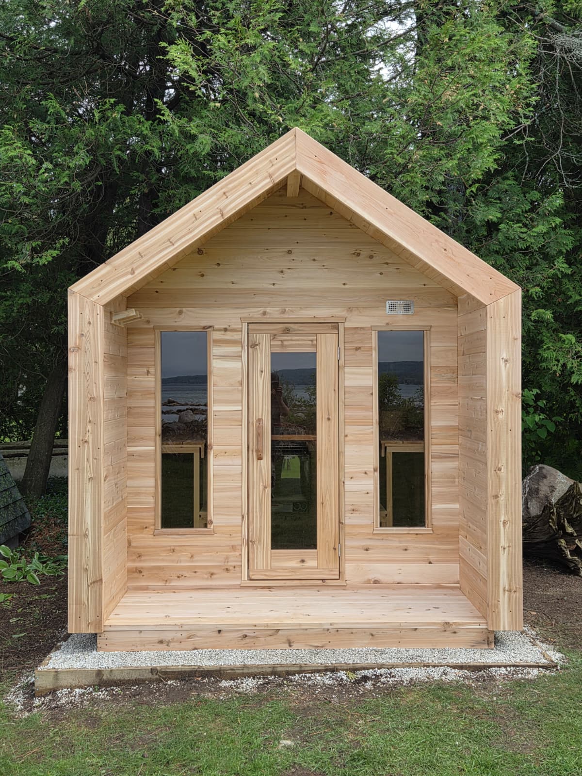Modern Cabin Sauna with Steel Roof and Siding with 2 Front Windows