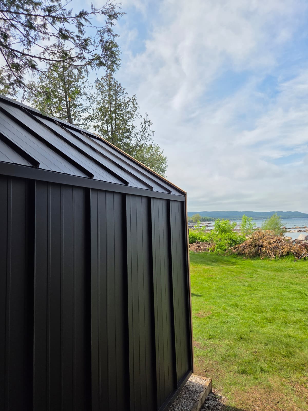 Modern Cabin Sauna with Steel Roof and Siding with 2 Front Windows