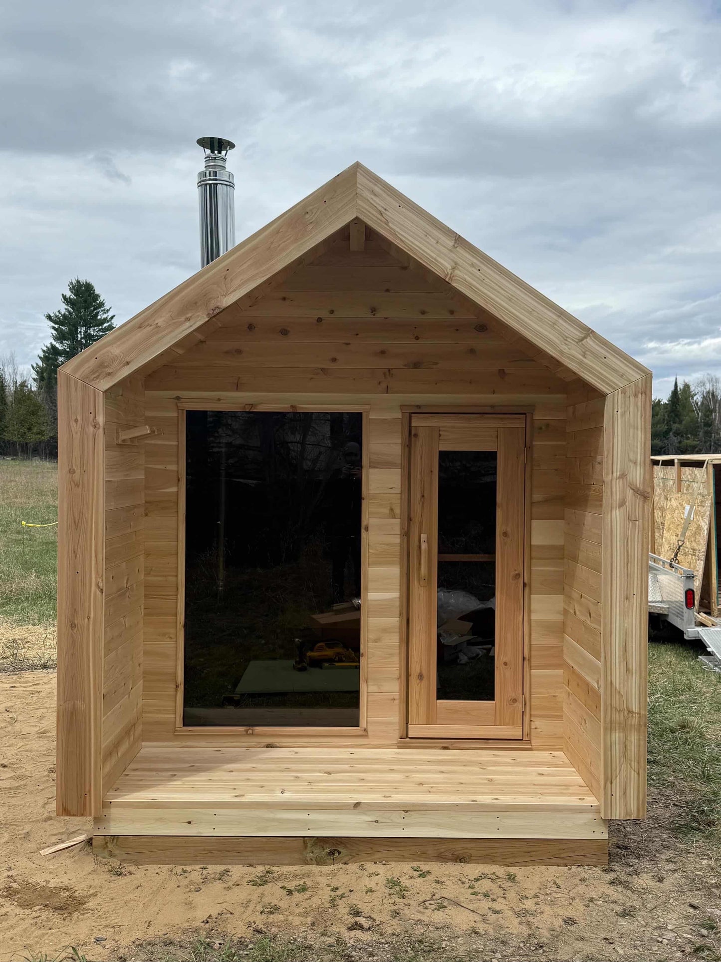 Modern Cabin Sauna with Steel Roof and Siding with 2 Front Windows